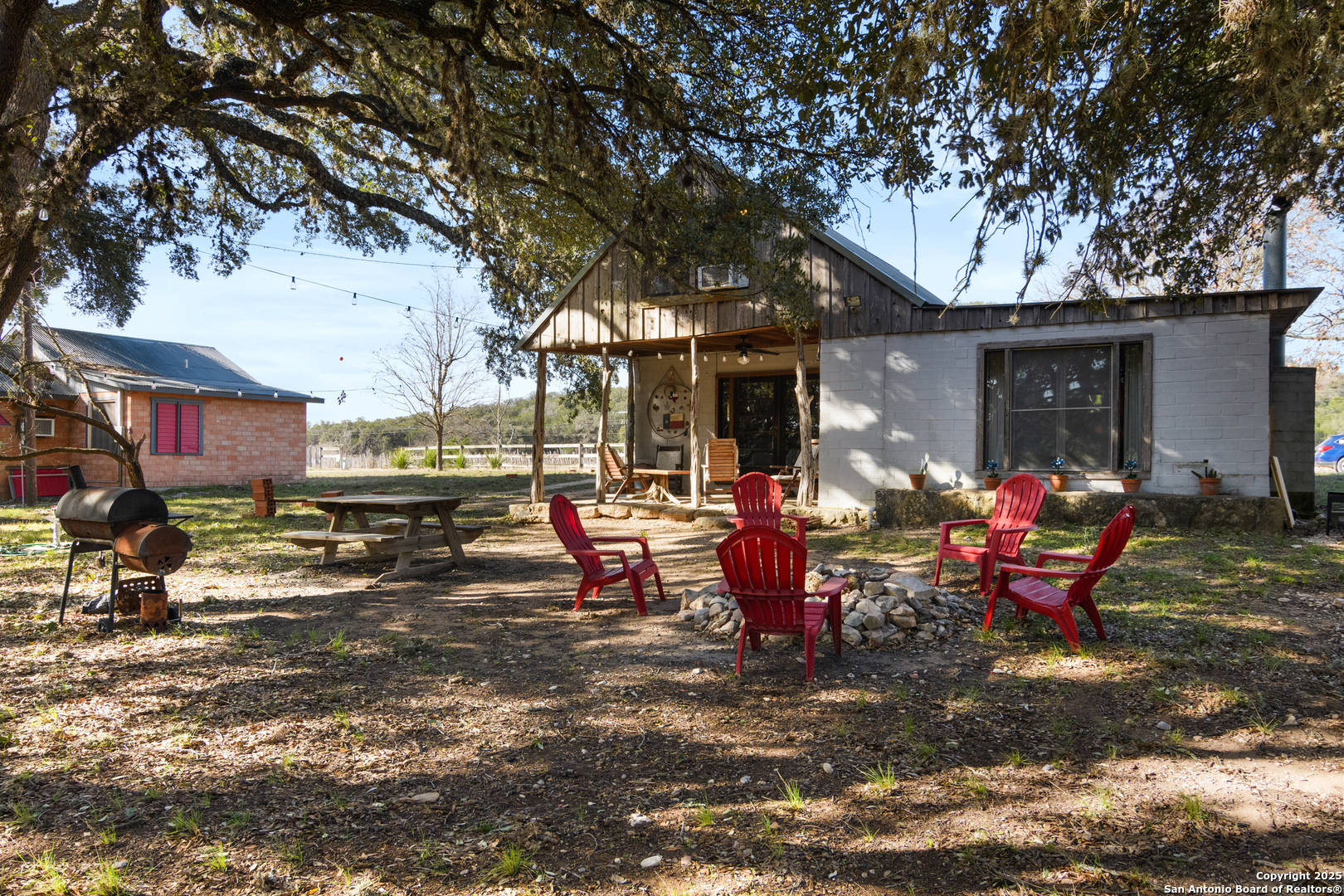 62 Turkey Trot Uvalde, TX 78801 - Photo 20 of 39 a group of people sitting in a backyard of a house