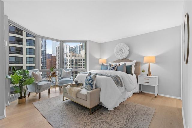 a bedroom with a bed and a couch