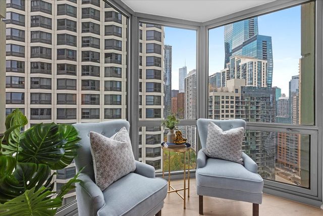 a view of a livingroom with furniture and a window