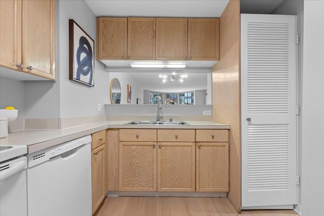 a kitchen with cabinets and a sink