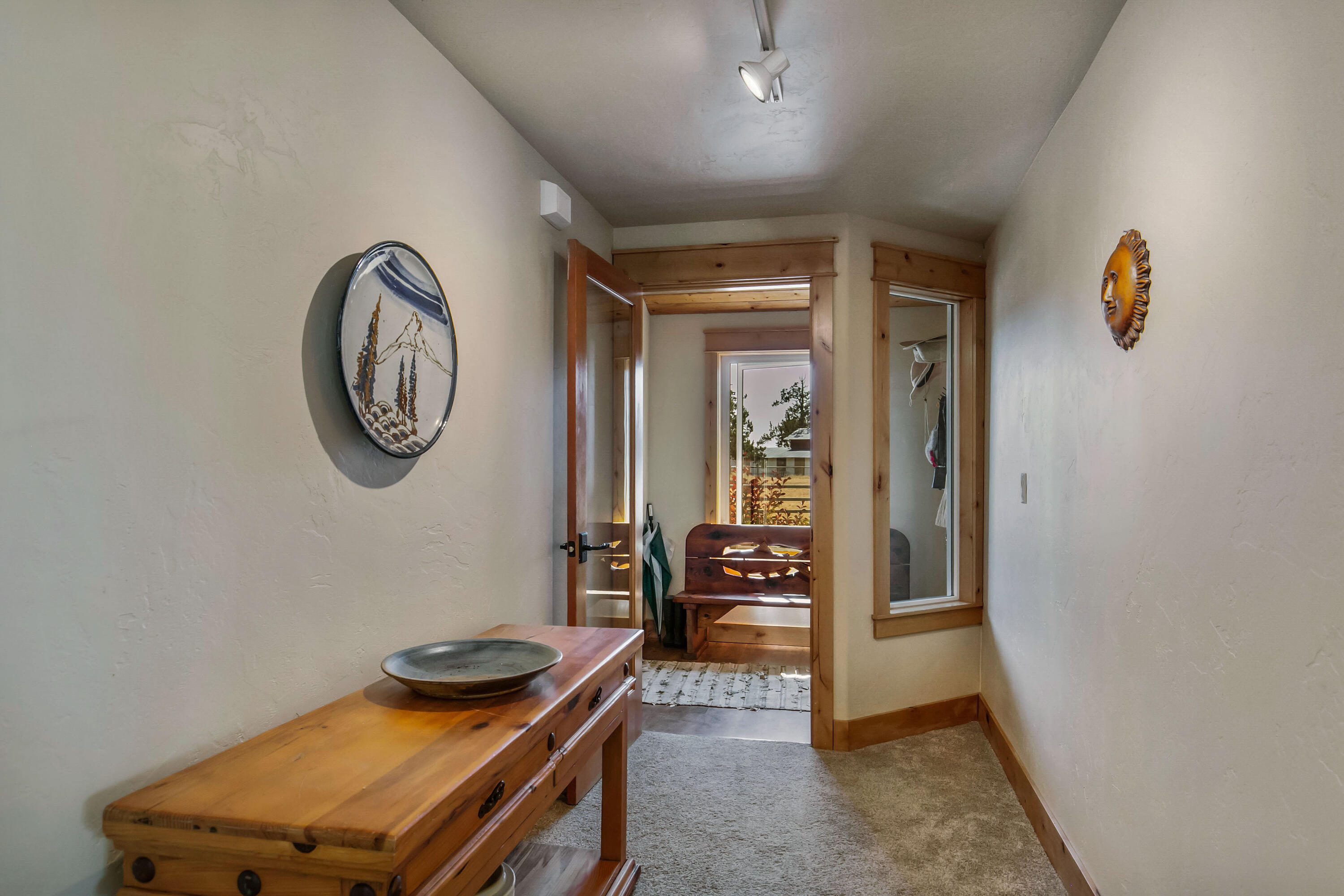 20155 Marsh Road Bend, OR 97703 - Photo 2 of 39 a room with a table and a mirror