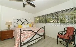 a bedroom with a bed window and a dresser