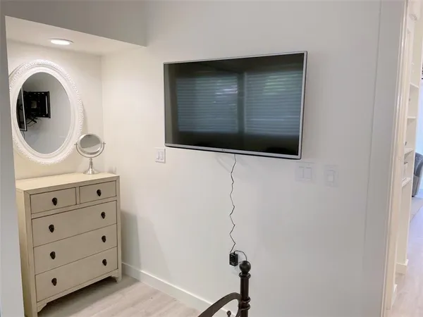 a view of a hallway with washer and dryer