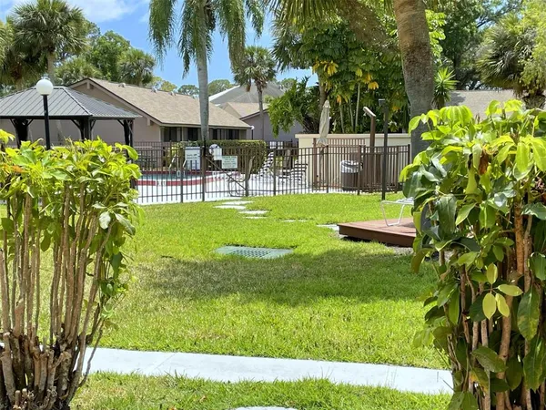 a view of a swimming pool with a garden
