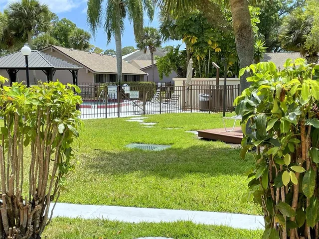 a view of a swimming pool with a garden