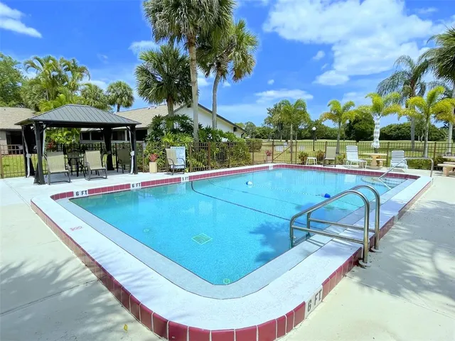a view of a swimming pool with lounge chair