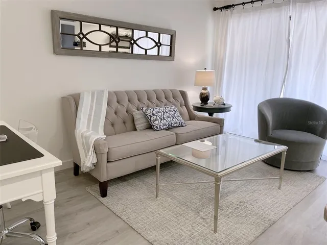 a living room with furniture and a window
