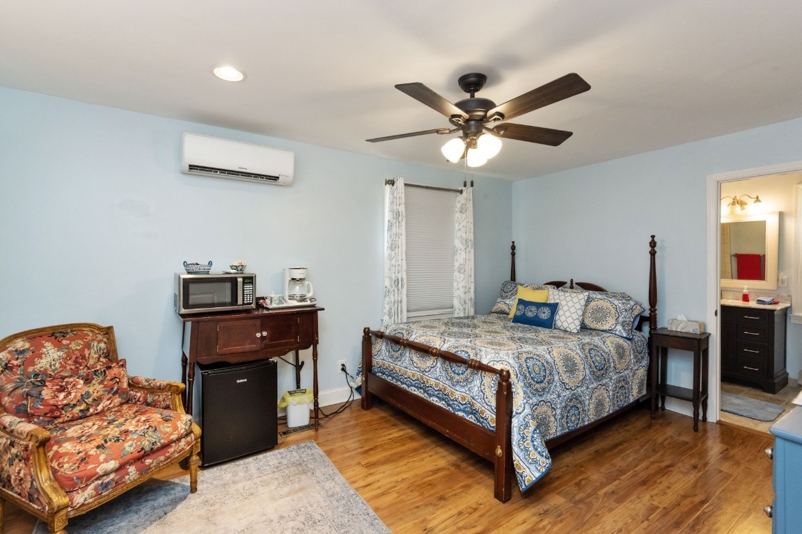 5895 Murfreesboro Road Lebanon, TN 37090 - Photo 11 of 31 a bedroom with a bed and wooden floor
