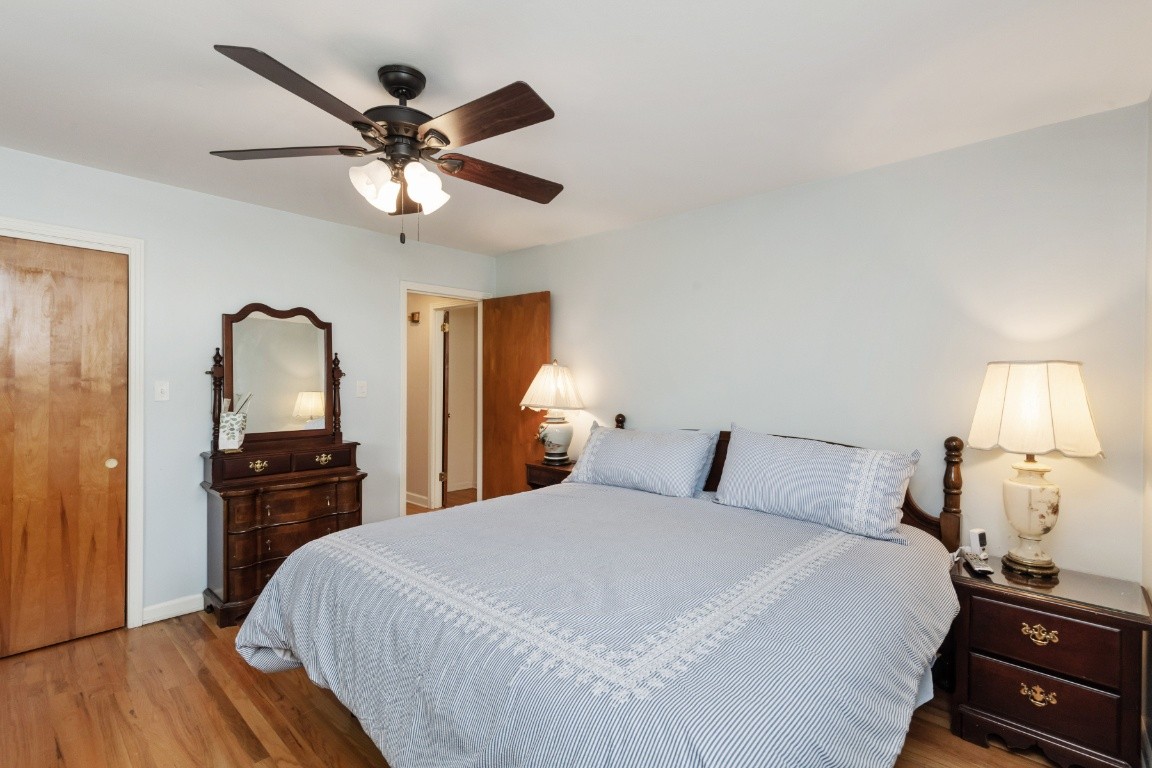 5895 Murfreesboro Road Lebanon, TN 37090 - Photo 16 of 31 a bedroom with a bed and wooden floor