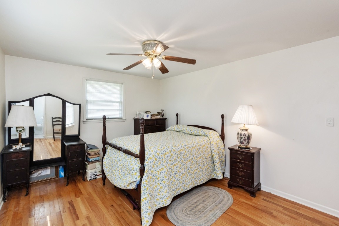 5895 Murfreesboro Road Lebanon, TN 37090 - Photo 17 of 31 a bed room with a bed and a chandelier