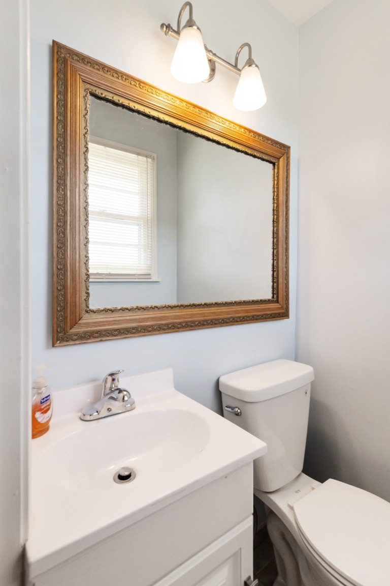 5895 Murfreesboro Road Lebanon, TN 37090 - Photo 19 of 31 a bathroom with a toilet sink and mirror