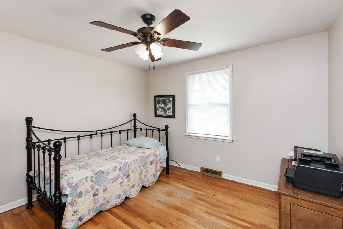 5895 Murfreesboro Road Lebanon, TN 37090 - Photo 20 of 31 a bedroom with bed and wooden floor