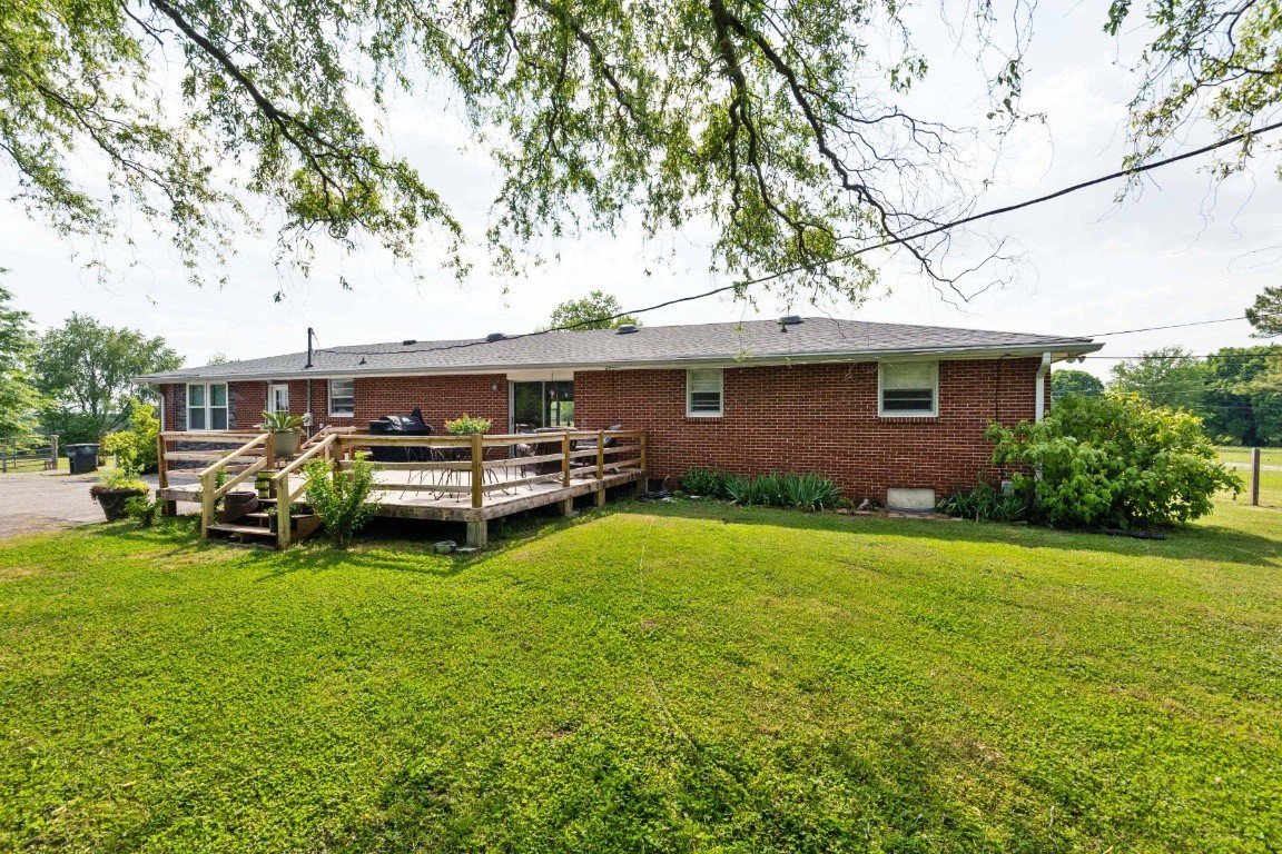 5895 Murfreesboro Road Lebanon, TN 37090 - Photo 26 of 31 a backyard of a house with table and chairs
