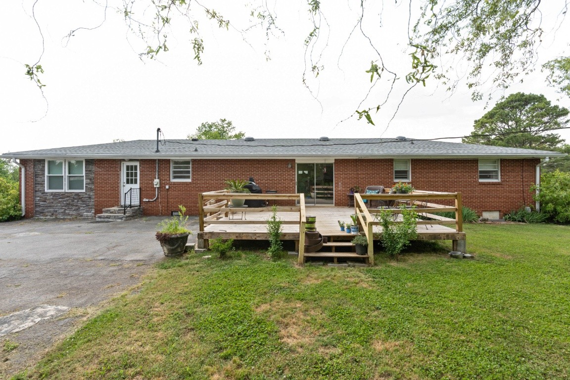 5895 Murfreesboro Road Lebanon, TN 37090 - Photo 29 of 31 a front view of a house with a garden and chairs