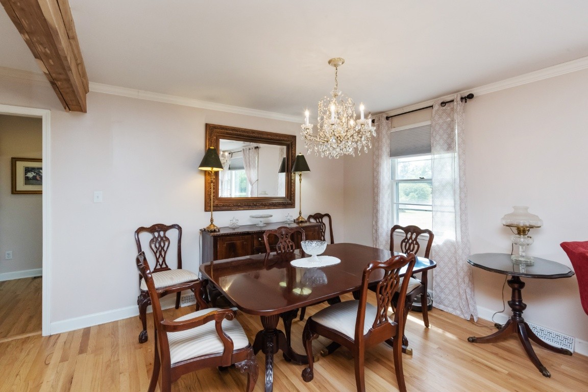 5895 Murfreesboro Road Lebanon, TN 37090 - Photo 4 of 31 a view of a dining room with furniture and wooden floor
