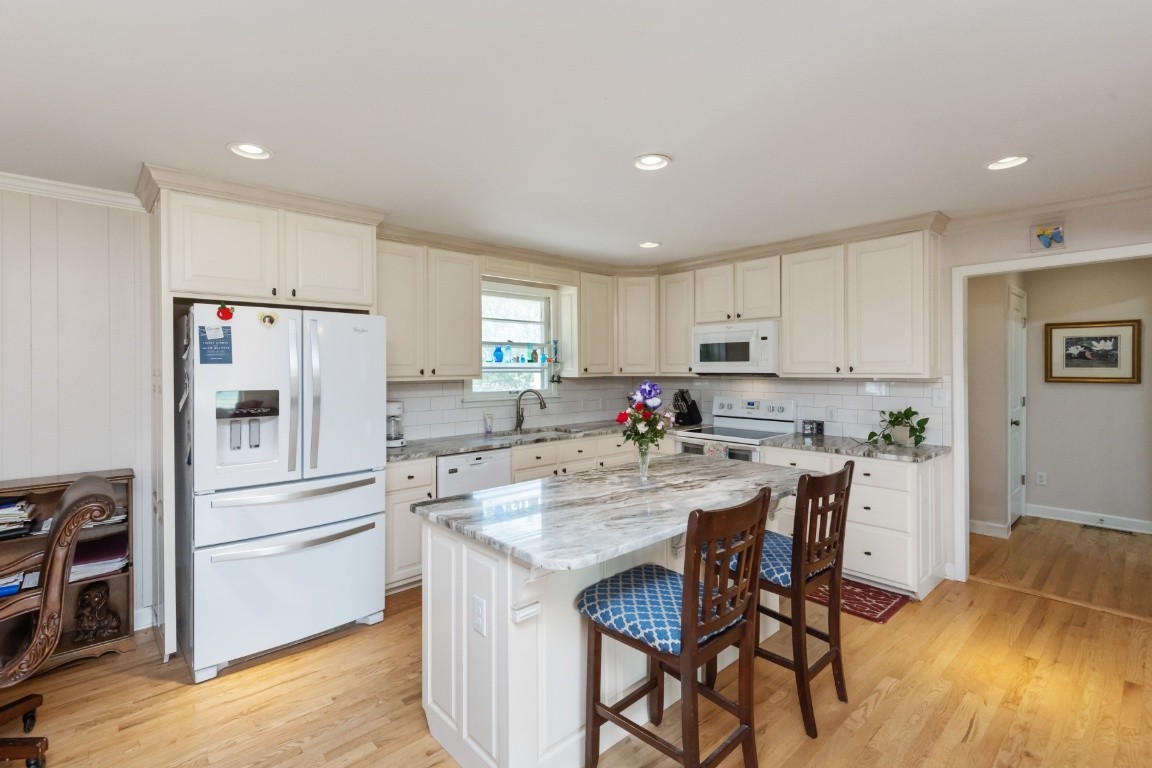 5895 Murfreesboro Road Lebanon, TN 37090 - Photo 5 of 31 a kitchen with white cabinets and stainless steel appliances