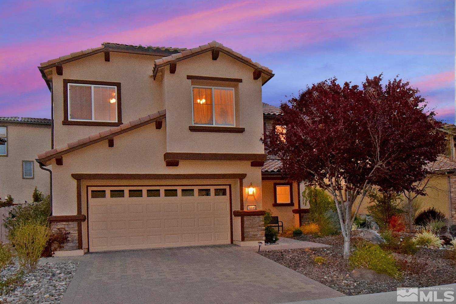 10685 Solano Court Reno, NV 89521 - Photo 1 of 32 a front view of a house with a yard