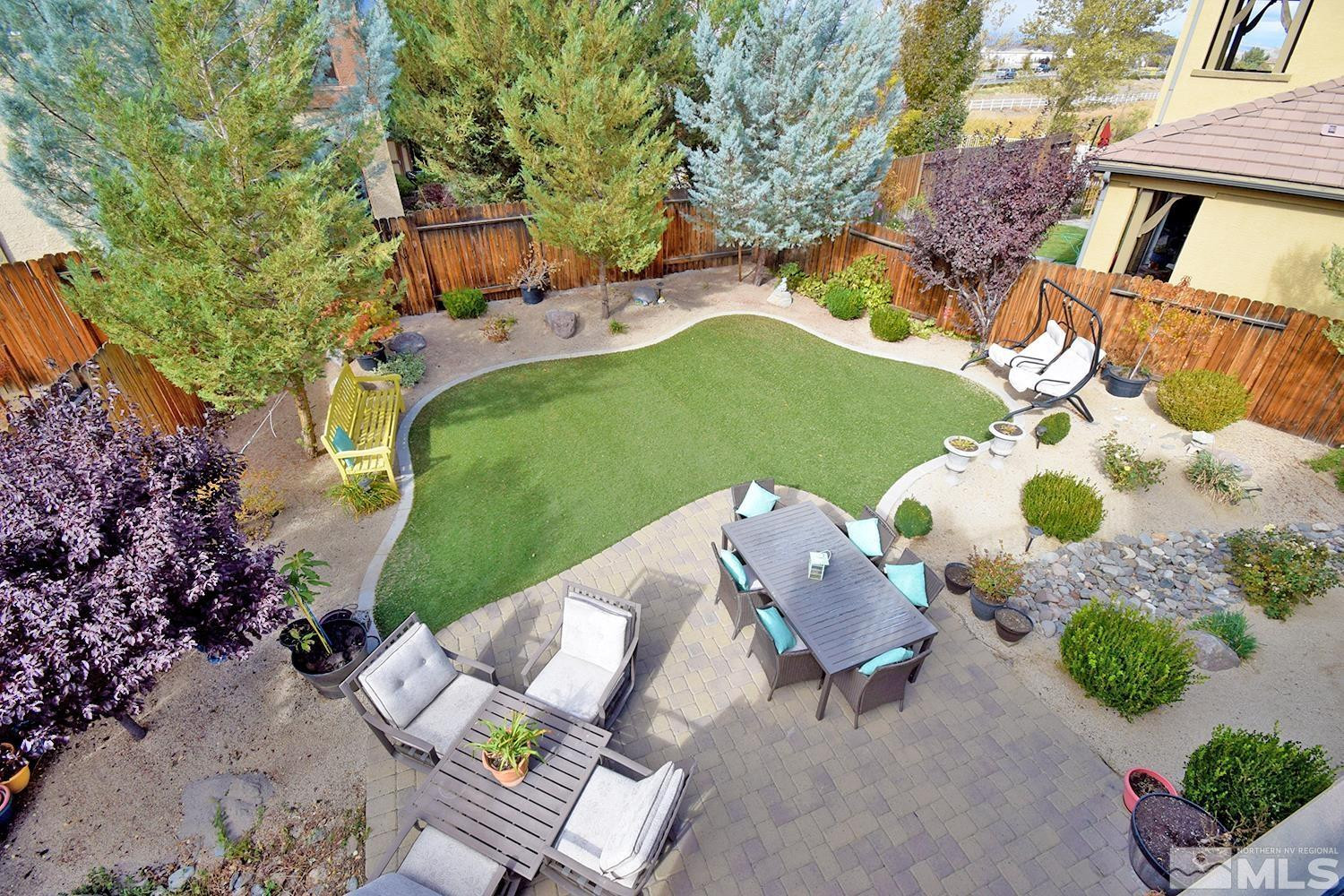 10685 Solano Court Reno, NV 89521 - Photo 30 of 32 a view of backyard with outdoor seating and green space