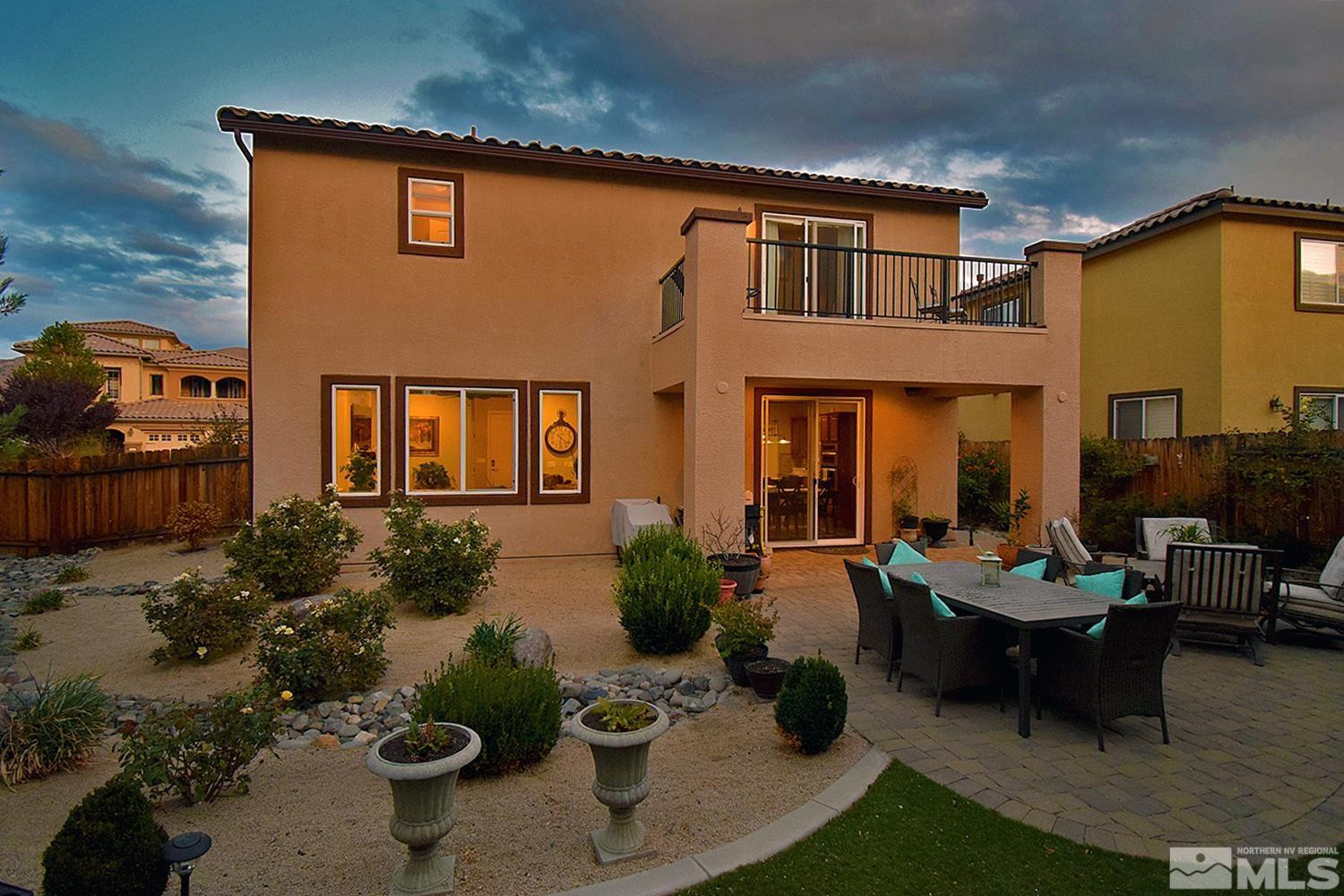 10685 Solano Court Reno, NV 89521 - Photo 3 of 32 a building outdoor space with patio furniture and potted plants