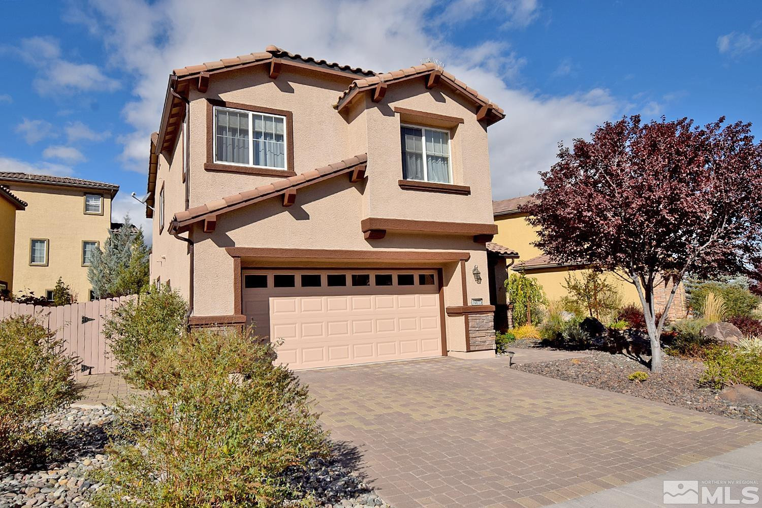 10685 Solano Court Reno, NV 89521 - Photo 5 of 32 a front view of a house with a yard and garage
