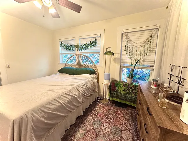 a bedroom with a bed and a table