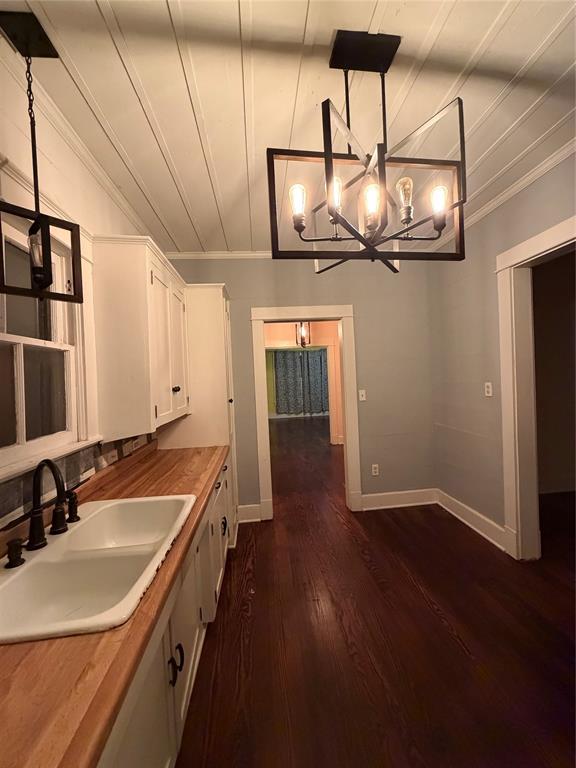 821 Ward Street Marlin, TX 76661 - Photo 12 of 22 a view of a kitchen with a sink and wooden floor