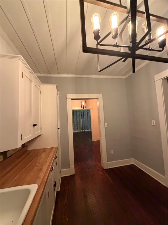 821 Ward Street Marlin, TX 76661 - Photo 13 of 22 an empty room with wooden floor and windows