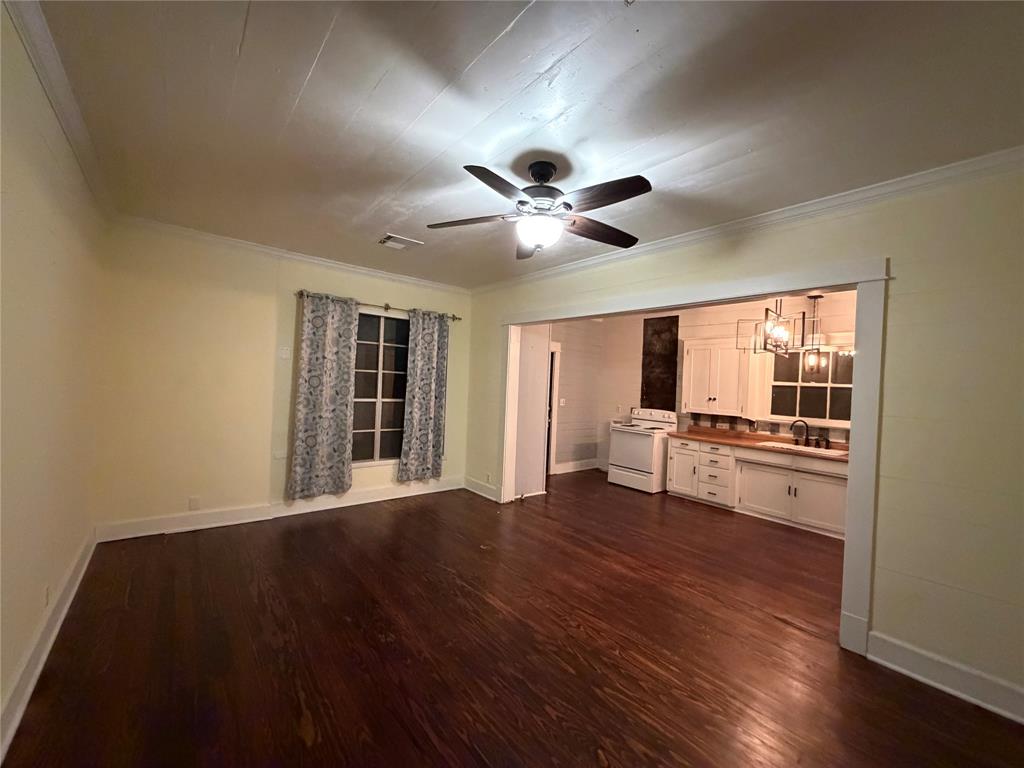 821 Ward Street Marlin, TX 76661 - Photo 15 of 22 a view of workspace with wooden floor and a window