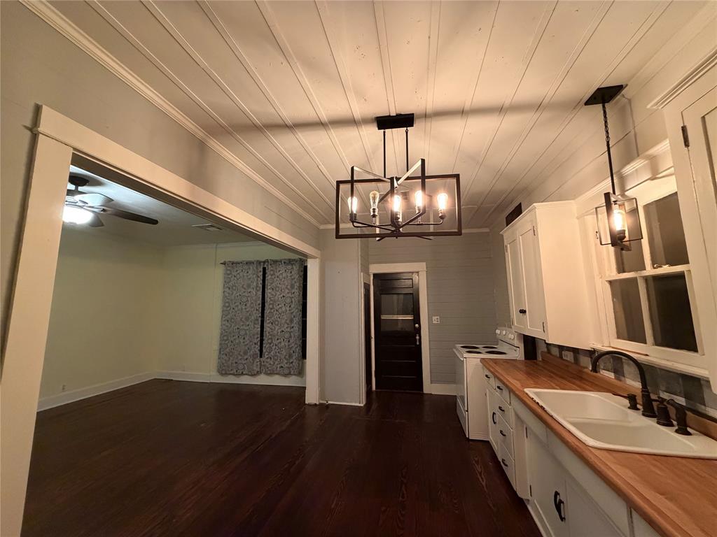 821 Ward Street Marlin, TX 76661 - Photo 21 of 22 a view of a kitchen from the hallway