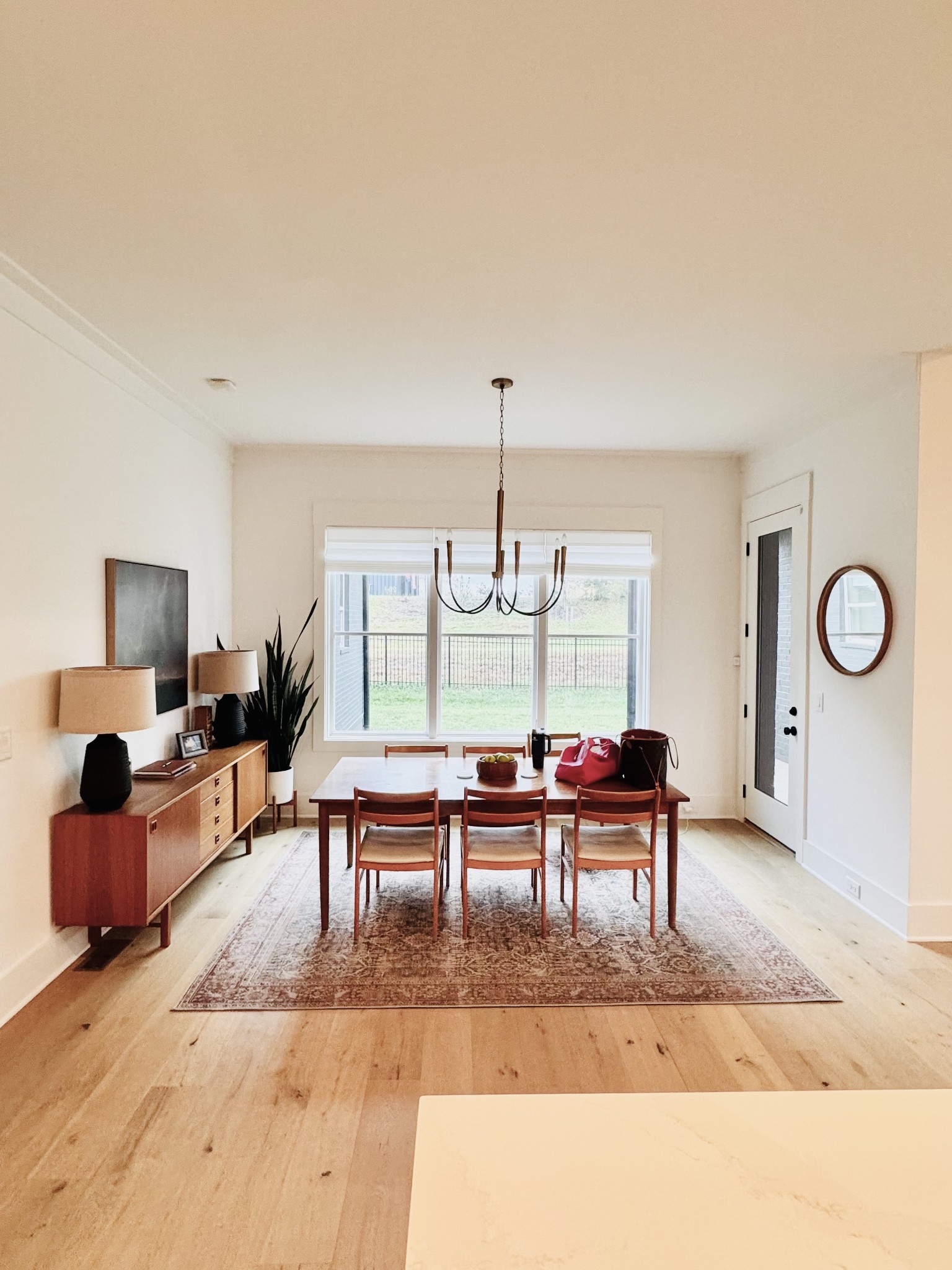 2725 Otterham Drive Thompson's Station, TN 37179 - Photo 11 of 36 a living room with furniture a rug and a chandelier