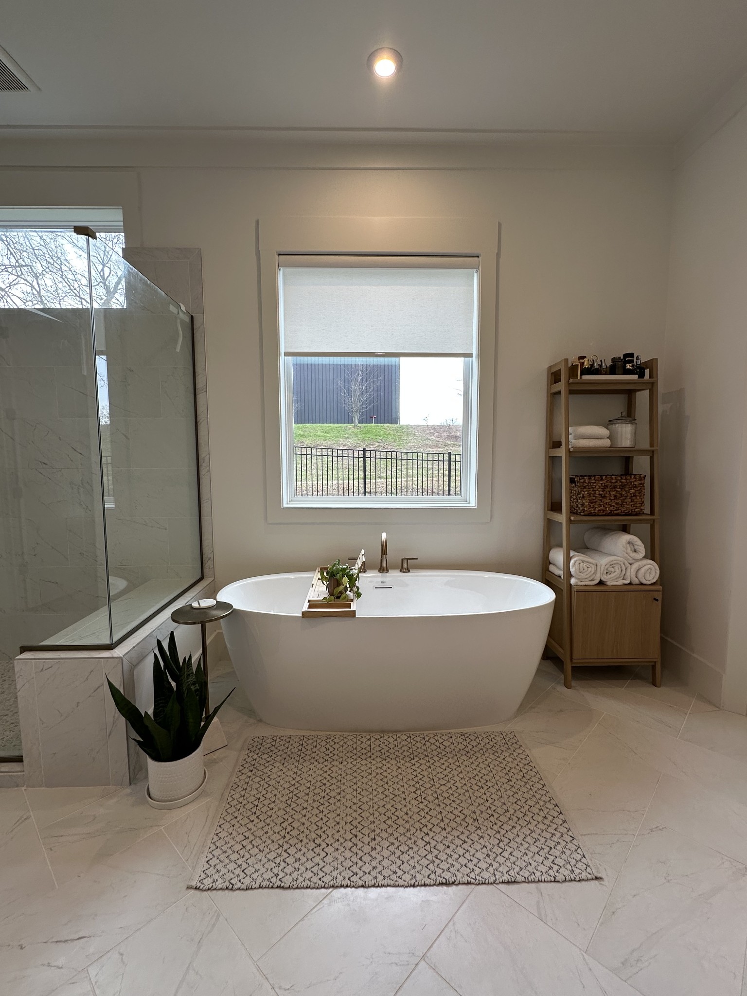 2725 Otterham Drive Thompson's Station, TN 37179 - Photo 15 of 36 a spacious bathroom with a bathtub and chandelier