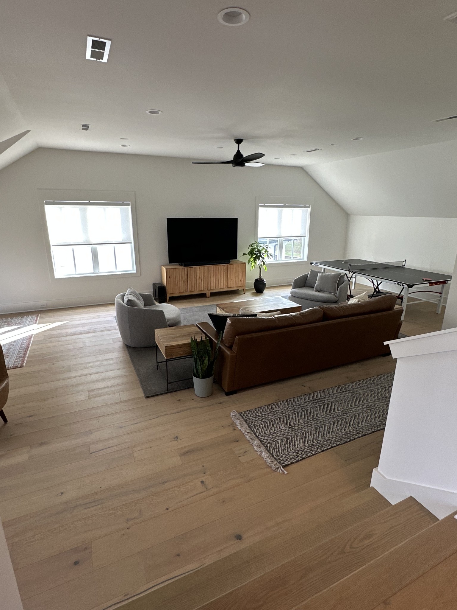 2725 Otterham Drive Thompson's Station, TN 37179 - Photo 24 of 36 a living room with stainless steel appliances furniture and a flat screen tv