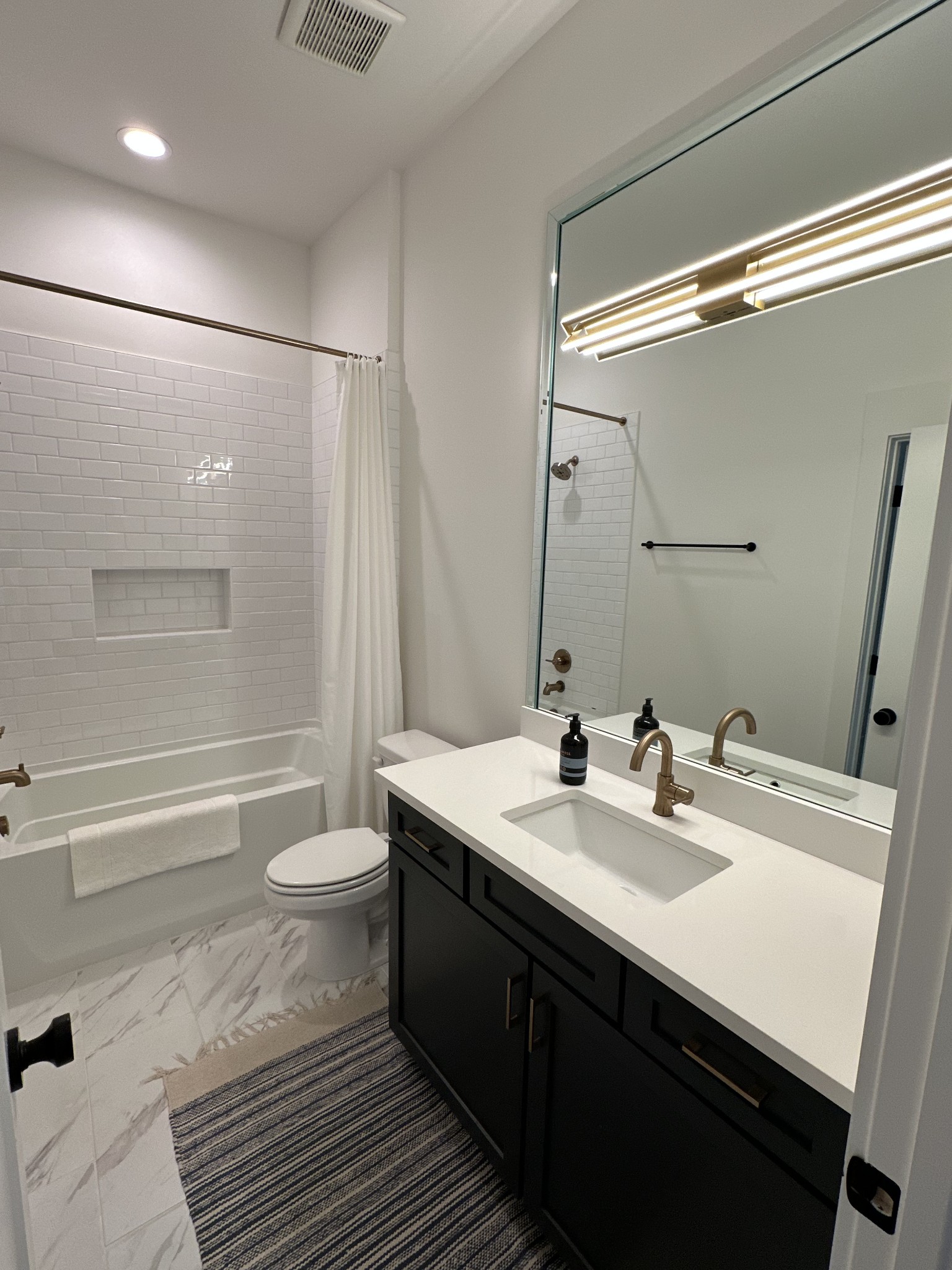 2725 Otterham Drive Thompson's Station, TN 37179 - Photo 26 of 36 a bathroom with a double vanity sink toilet and shower