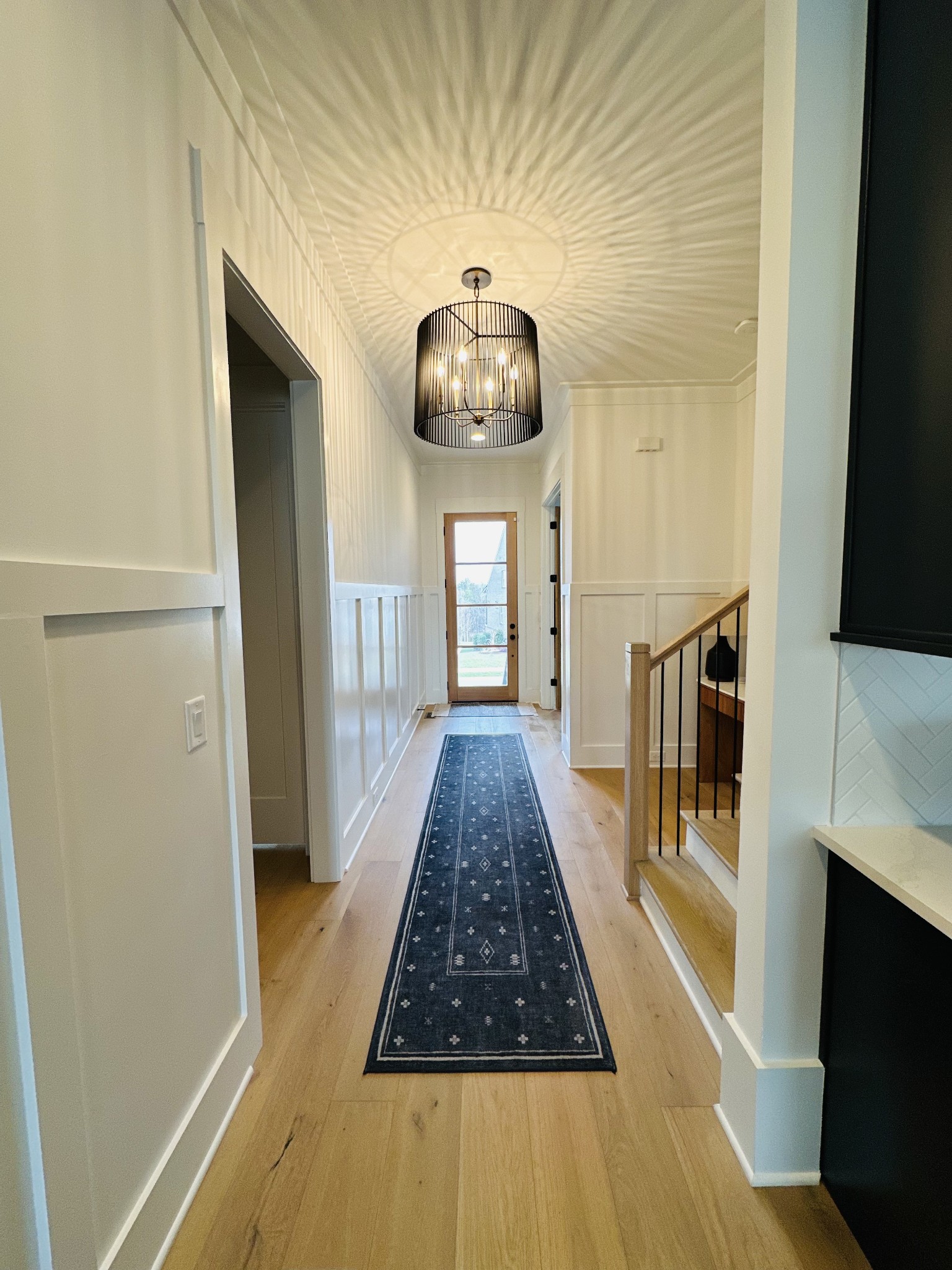 2725 Otterham Drive Thompson's Station, TN 37179 - Photo 5 of 36 a hallway view with wooden floor and staircase