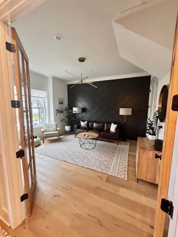 a bed room with a bed and a chandelier