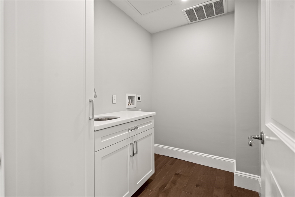 20 Mechanic Square, Unit 2 Marblehead, MA 01945 - Photo 32 of 42 a utility room with a sink dryer and washer