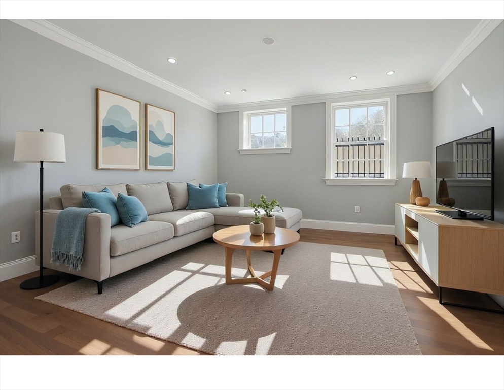 20 Mechanic Square, Unit 2 Marblehead, MA 01945 - Photo 33 of 42 a living room with furniture a flat screen tv and a window