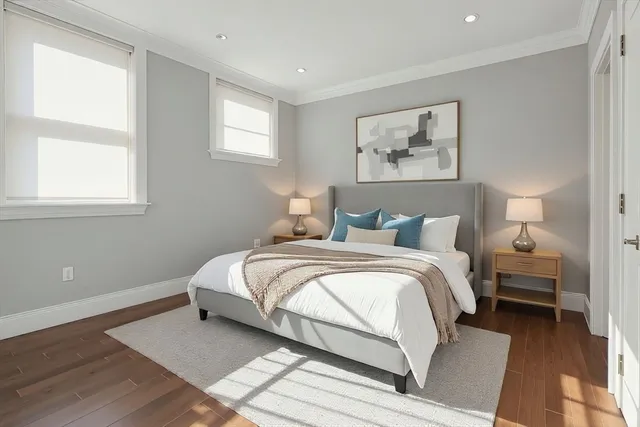 a bedroom with bed and a window