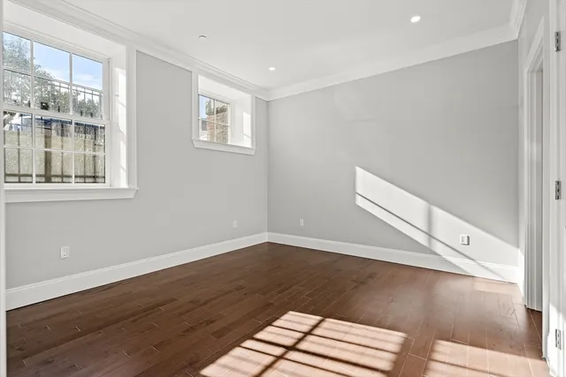 a view of a livingroom with wooden floor