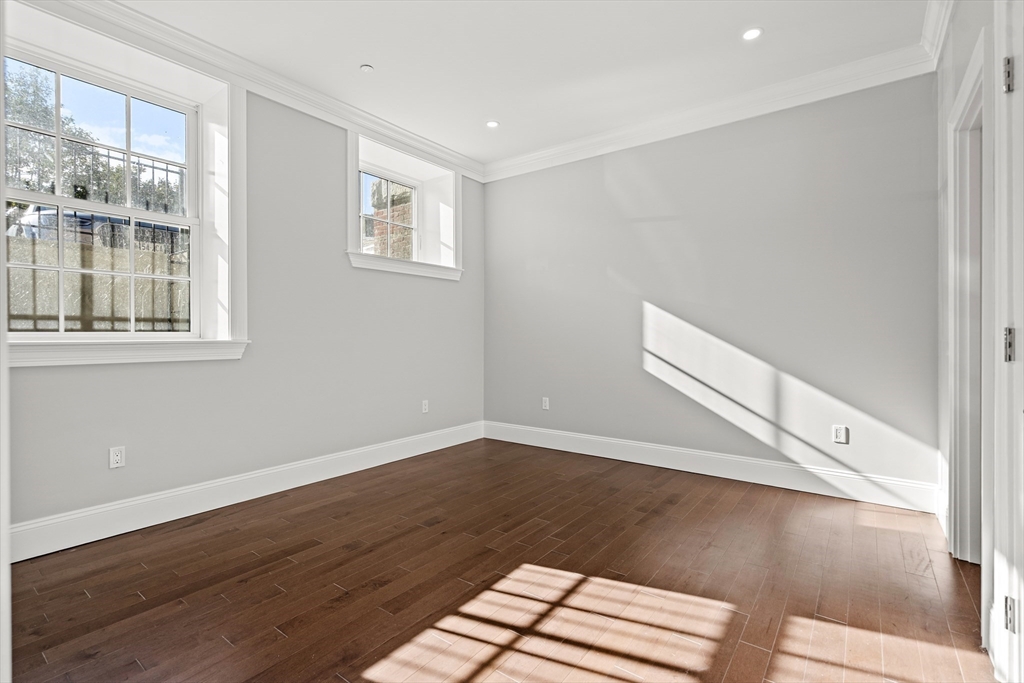 20 Mechanic Square, Unit 2 Marblehead, MA 01945 - Photo 38 of 42 a view of a livingroom with wooden floor