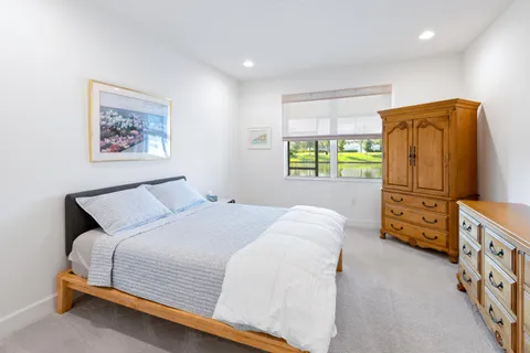 a bedroom with furniture and a window