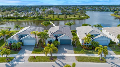 an aerial view of a house with a lake view