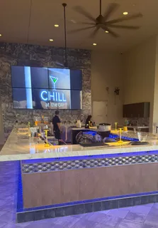 a living room with furniture large window and flat screen tv