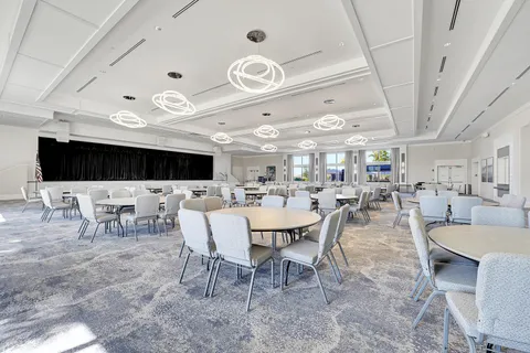 a view of a cafe with sitting area