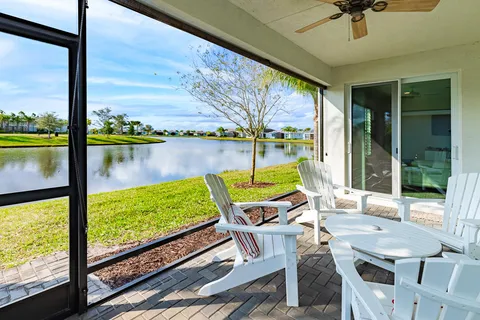 a view of a chairs and table in patio