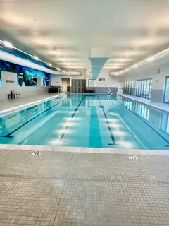 a kitchen with stainless steel appliances granite countertop lots of counter top space and furniture