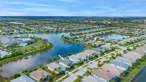 an aerial view of a house with a lake lake view