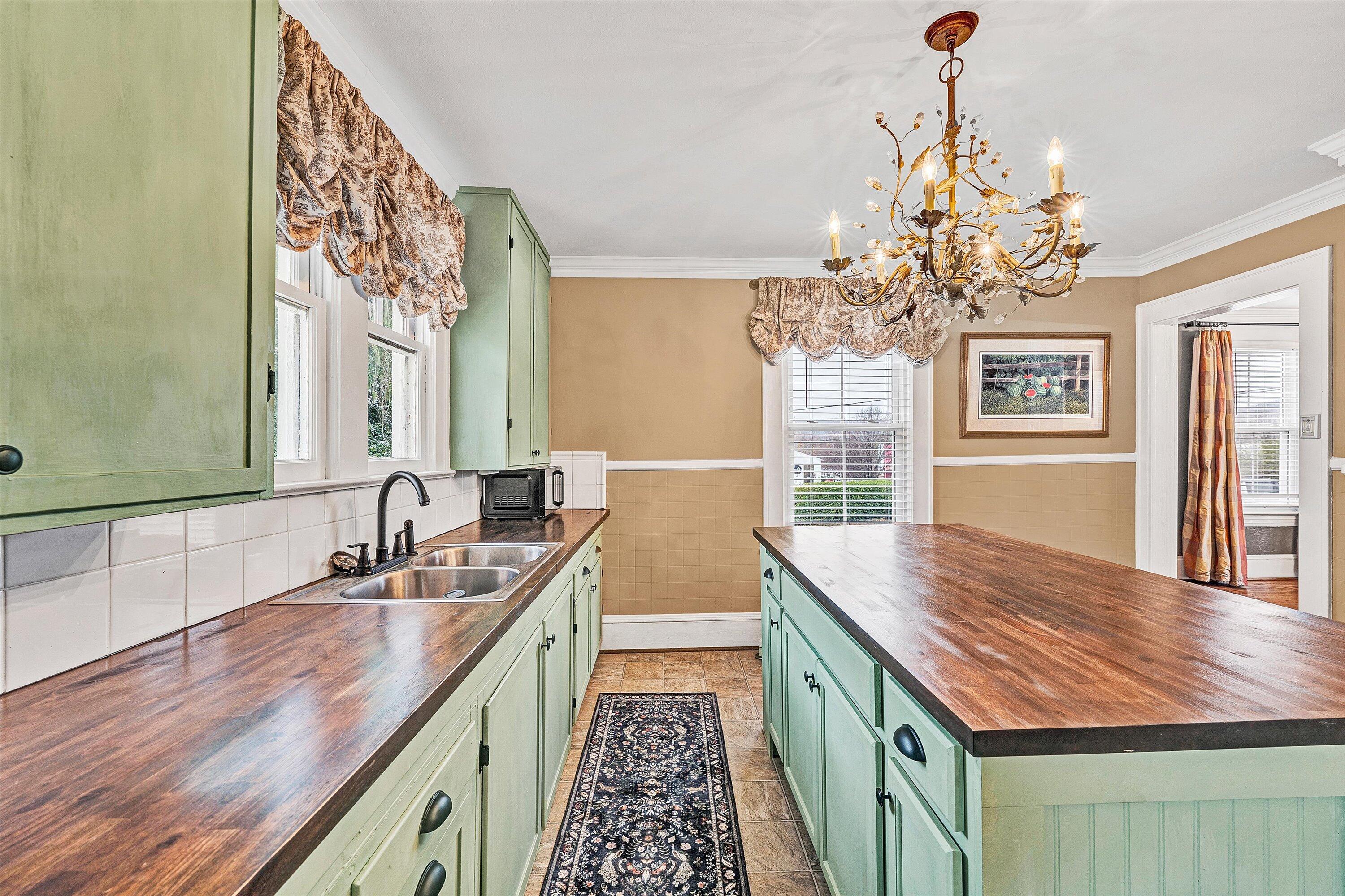 40 High Street Rocky Mount, VA 24151 - Photo 11 of 36 a bathroom with a granite countertop sink a large mirror and a shower