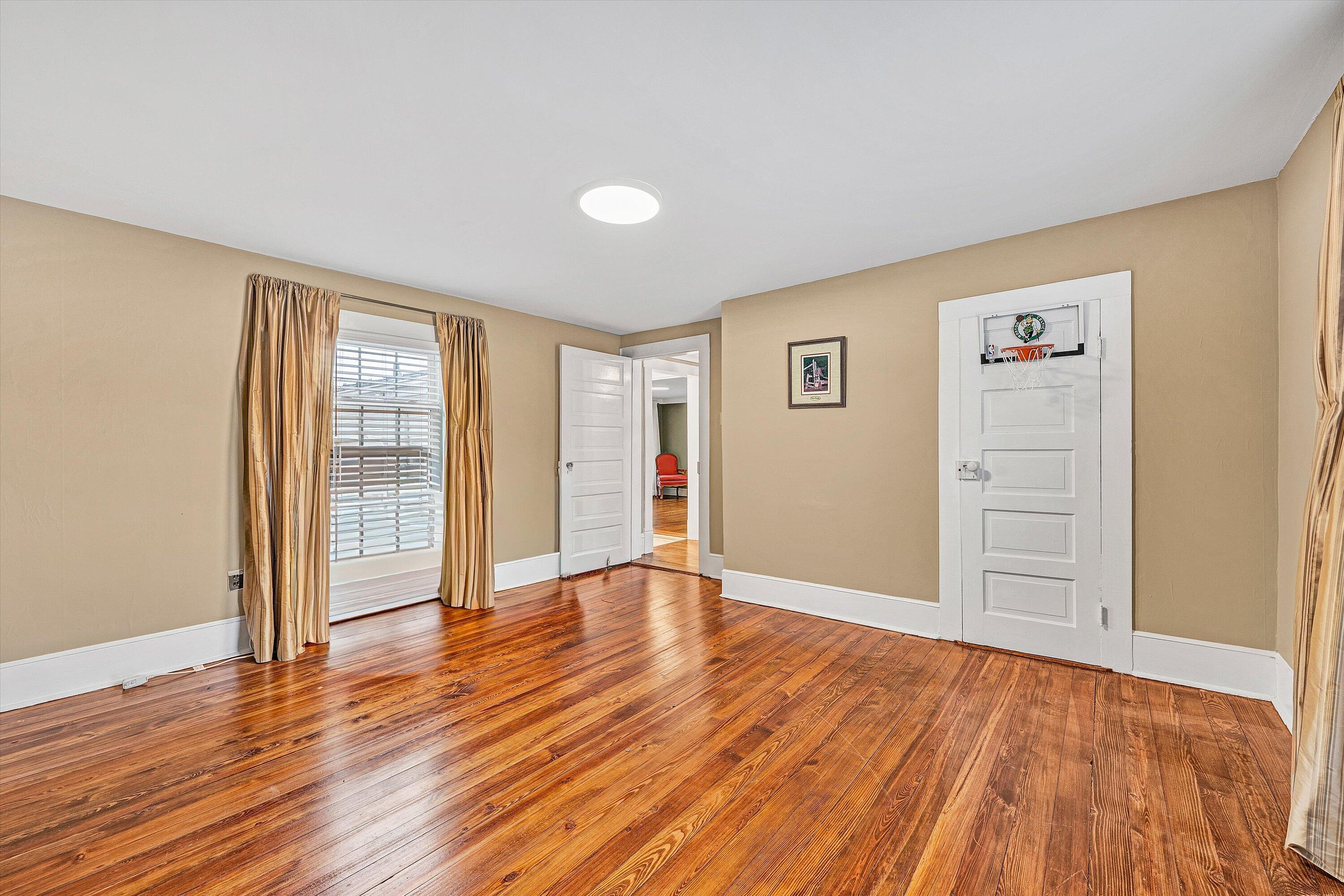 40 High Street Rocky Mount, VA 24151 - Photo 23 of 36 a view of an empty room with wooden floor and a window