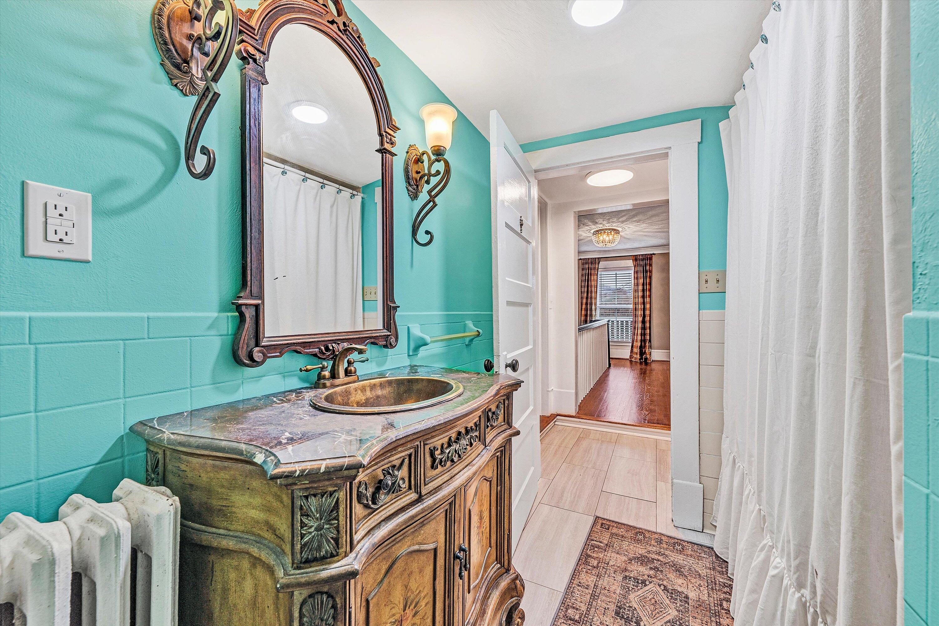 40 High Street Rocky Mount, VA 24151 - Photo 25 of 36 a bathroom with a sink a mirror and a bathtub